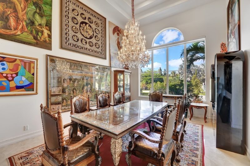 estate-formal-dining Formal dining room with crystal chandelier and arched windows