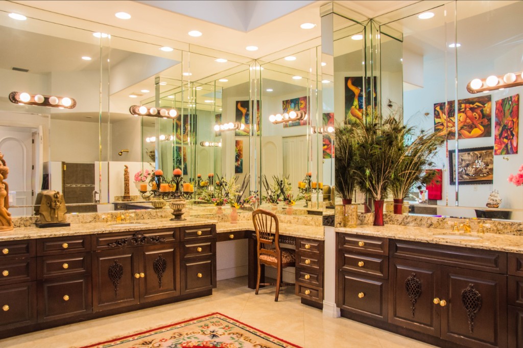 estate-primary-bath Primary bath with double vanities and mirrored walls